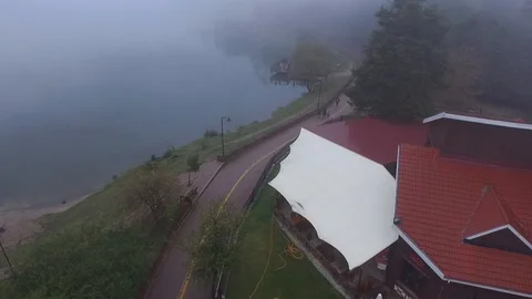 Clouds house with drone flight lake view Stock Footage 108589099