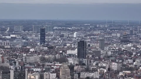 Clouds hover as Brussels' aerial expanse marries historic streets with modern  Stock Footage 250417272