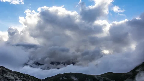 Clouds Hover Over the Mountains Stock Footage 146785986