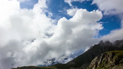 Clouds Hover Over the Mountains Stock Footage 147985666