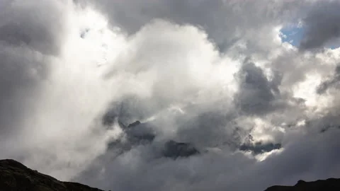 Clouds Hover Over the Mountains Stock Footage 147985698