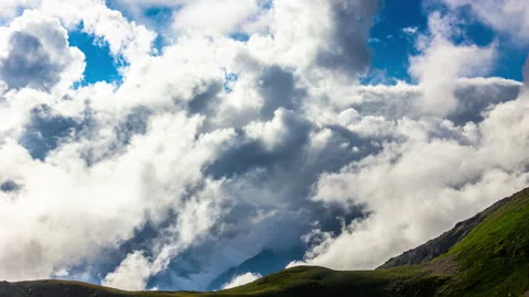 Clouds Hover Over the Mountains Stock Footage 147985749