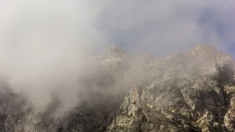 Clouds Hover Over the Mountains Stock Footage 148071068