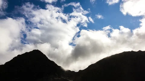 Clouds Hover Over the Mountains Stock Footage 148071147