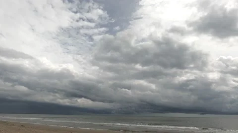 Clouds hovering low, covering the sky above the sea.  Signs of the coming rain Stock Footage 221214194