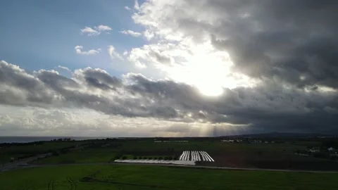 Clouds hung in the interim over the green fields. On the mediterranean sea. Stock Footage 236502277