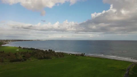 Clouds hung in the interim over the green fields. On the mediterranean sea. Stock Footage 236502295