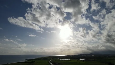 Clouds hung in the interim over the green fields. On the mediterranean sea. Stock Footage 236502426