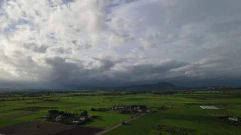 Clouds hung in the interim over the green fields. Stock-Footage 236502647