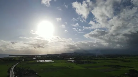 Clouds hung in the interim over the green fields. On the mediterranean sea. Stock Footage 236502701