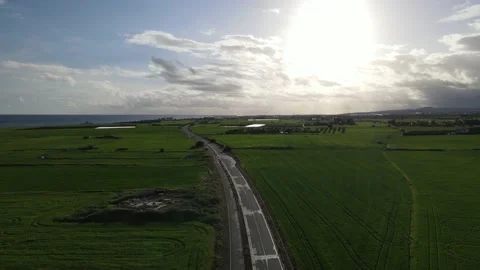 Clouds hung in the interim over the green fields. On the mediterranean sea. Video stock 236503827