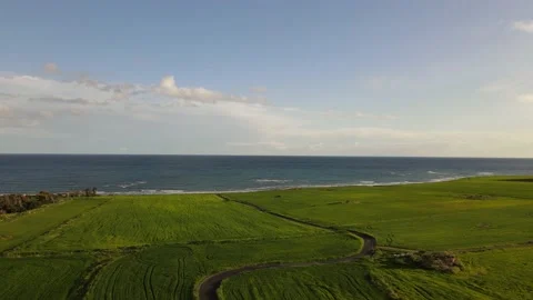 Clouds hung in the interim over the green fields. On the mediterranean sea. 動画素材 236503828