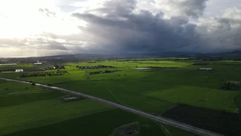 Clouds hung in the interim over the green fields. Video stock 236504861