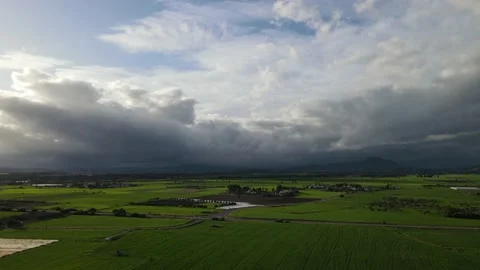 Clouds hung in the interim over the green fields. Stock Footage 236505114