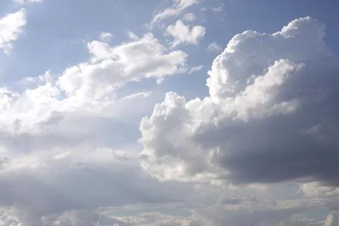 Clouds illuminated by bright sunlight Stock Photos
