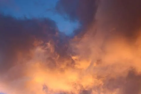 Clouds illuminated at sunrise. Stock Photos