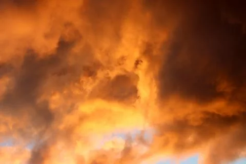 Clouds illuminated at sunrise. Stock Photos