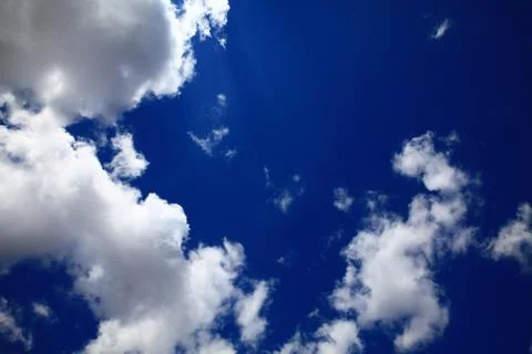 Clouds infront ob blue sky Stock Photos