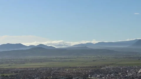 Clouds Lapping against the Mountains like Waves by the Sea Stock Footage 314339274