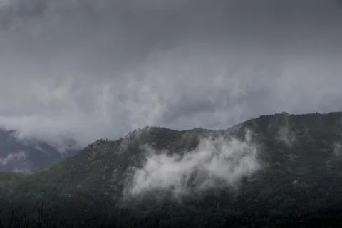 Clouds lifting up from the mountains Stock-Fotos