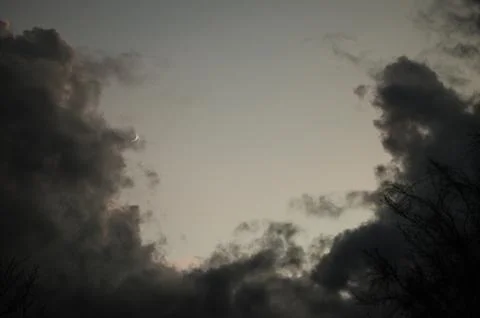 Clouds in the light of the moon, the moon accompanied by clouds in the form o Stock Photos