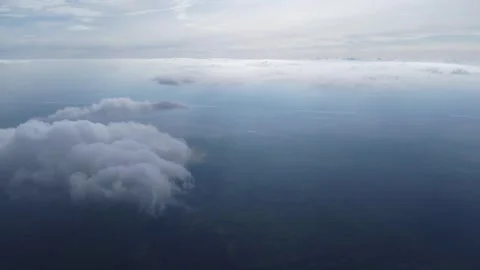 Clouds with Light Rays and Earth Below Aerial View Video stock 312897169