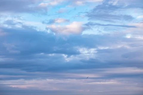 Clouds lit by the setting sun Stock Photos