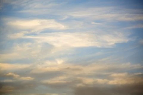 Clouds lit up in the sky at sunset.	3 Stock Photos
