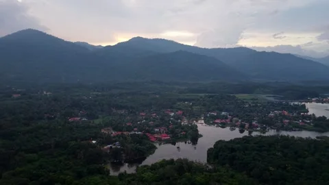 Clouds loom over distant mountains Stock Footage 344816806