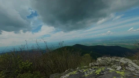 Clouds loom over rolling green mountains. Jastrebac Mountain, Serbia. Timelapse Video stock 336023232