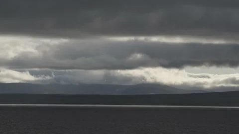 Clouds low fly over the sea and coastal line. Stock Footage 142760716