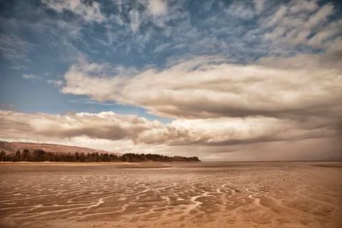 Clouds at low tide Stock Photos