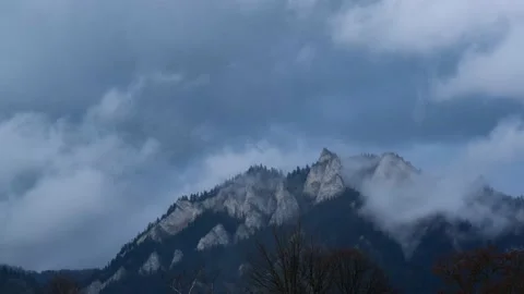 Clouds make amazing hills disappear Stock Footage 132254331