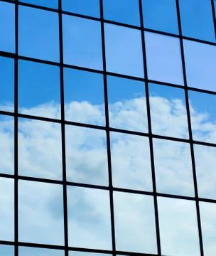 Clouds Mirrored in Modern Building Stock Photos