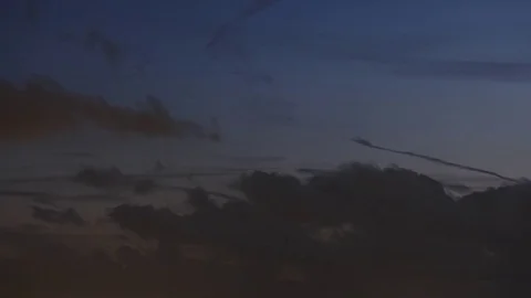 Clouds moody timelapse in dusk as the sun sets Stock-Footage 74697384