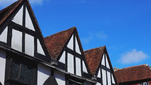 Clouds mooving fast over typical old houses roofs Vidéo 127801300