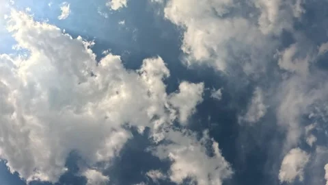 Clouds in motion on a blue sky 動画素材 317687315