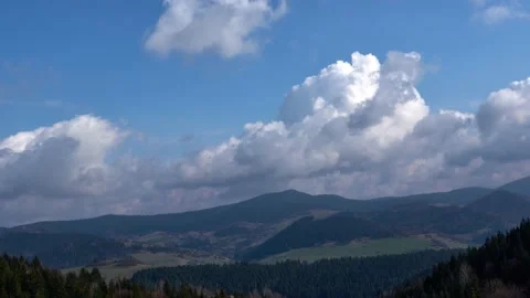 Clouds in motion over spring mountain landscape Stock Footage 167838425