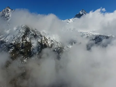 Clouds in mountain - Aerial view with drone over the clouds Stock Footage 73918640