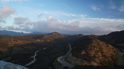 Clouds Mountain and  the road.time lapse.  Stock Footage 81107863