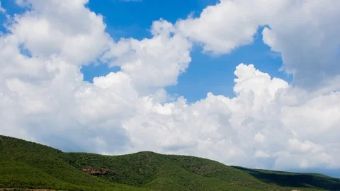 Clouds on mountain shadow daytime timelapse Stock Footage 96323464