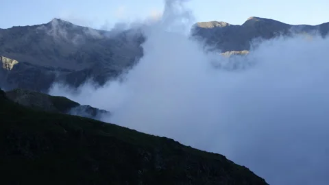 Clouds in a mountain valley. Sunset in the mountains. Stock Footage 138999311