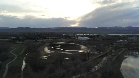 Clouds, mountains, city, water, trees - Drone camera moves back, up, and down Stock Footage 138266543