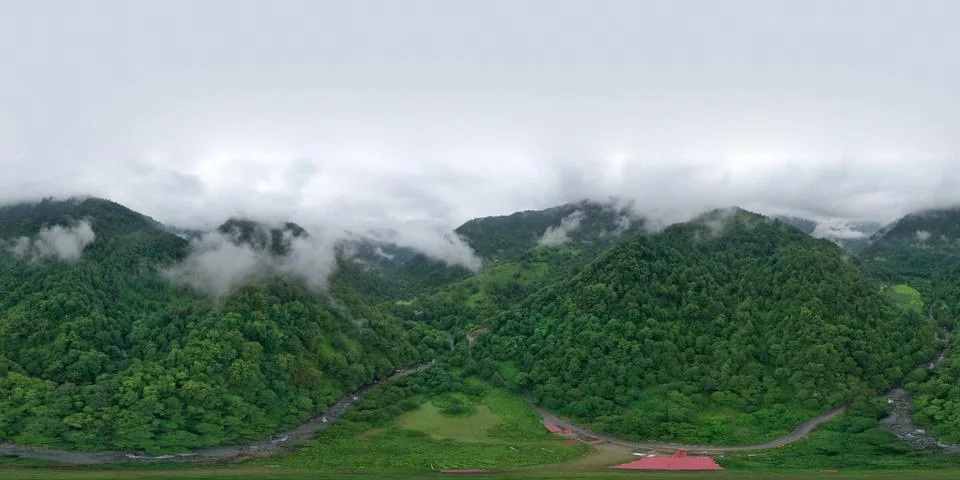 Clouds in the mountains from a drone Stock Photos
