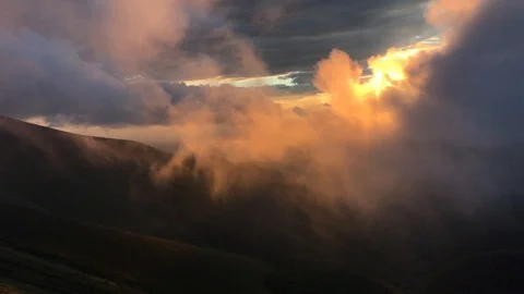 Clouds in the mountains moving over beautiful sunset Stock Footage 93305530
