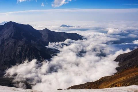 Clouds in mountains Stock Photos