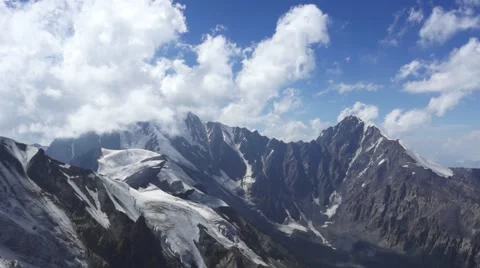 Clouds in mountains timelaps. Top of the mountain Kazbek. background Video stock 68681907