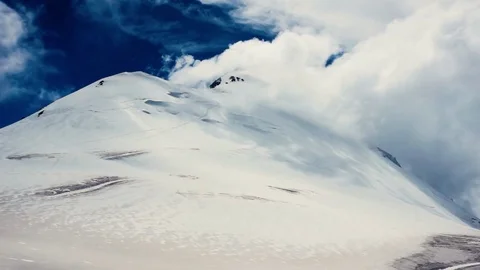 Clouds in mountains timelaps. Top on mountain. background Video stock 74715560