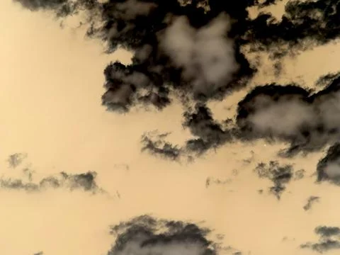 Clouds Move Across the Sky During Sunset With Shades of Orange and Gray Stock Photos