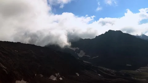 Clouds move in the alps 4k 30fps timelapse video Stock Footage 282866663